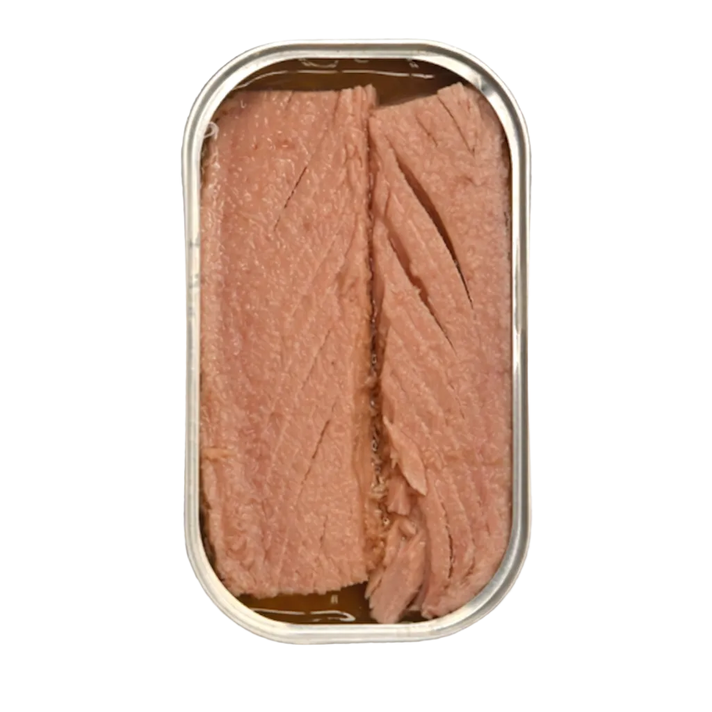 An open oval metal can of tuna fish with sliced pink tuna pieces visible inside, shown on a transparent checkerboard background.
